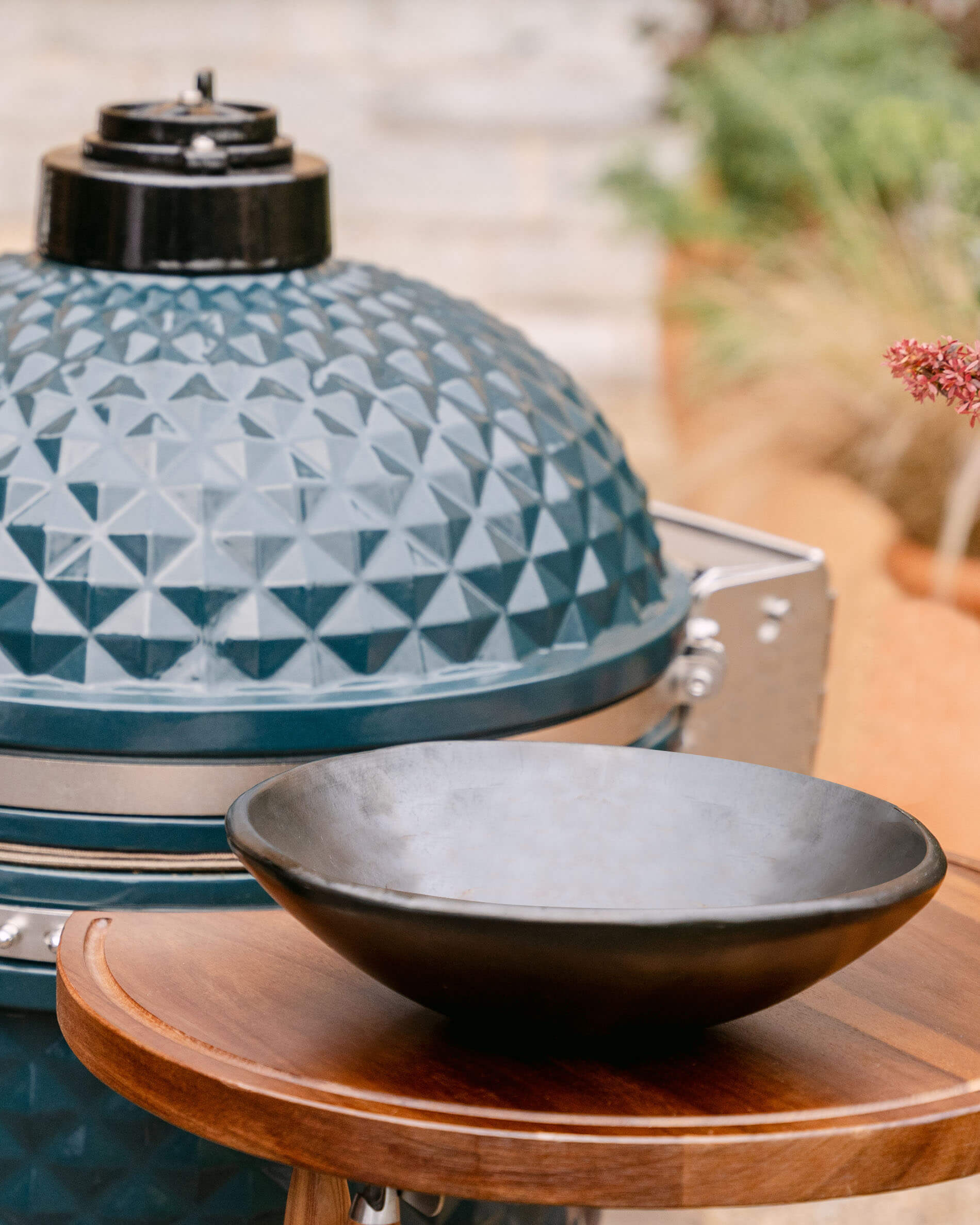 Large Black Chamba clay bowl in front of kamado