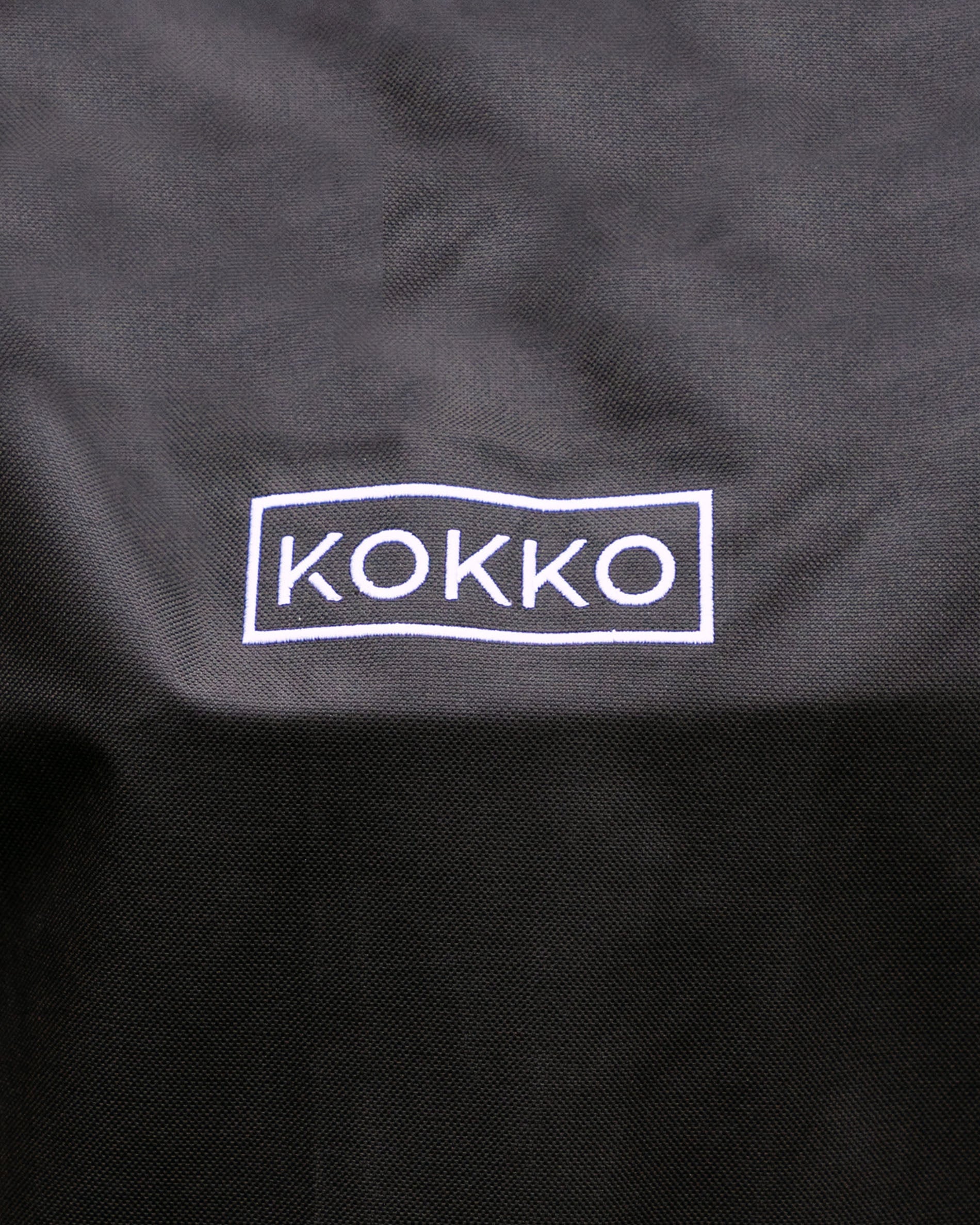 Black Kokko protective cover with white logo, suitable for Kokko kamados.