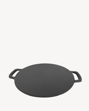 Plaque lisse ronde en fonte pour cuisson au kamado.