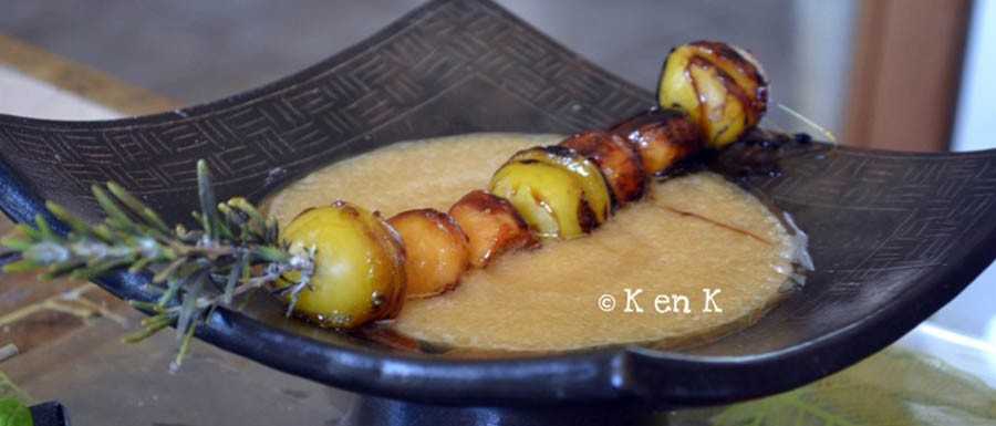 Skewers of fruit and melon soup